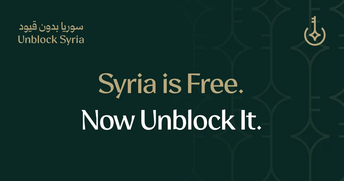 The Unblock Syria brand card: the wordmark, the key emblem, and the line Syria is Free. Now Unblock It.